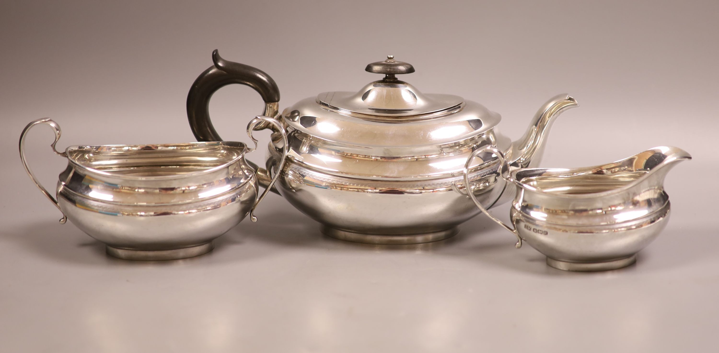 A George VI three-piece silver tea service, oval form, Sheffield 1939, Viner's Ltd, gross weight 35oz.